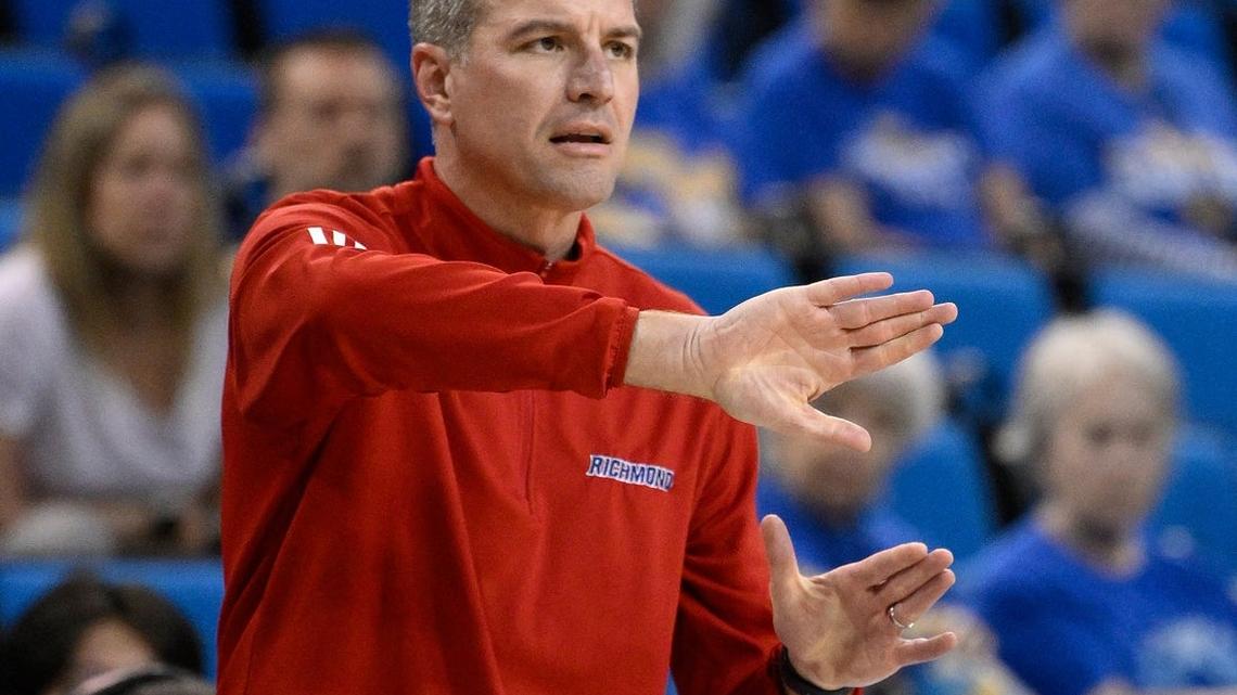 Virginia moves quickly to hire Aaron Roussell as coach 