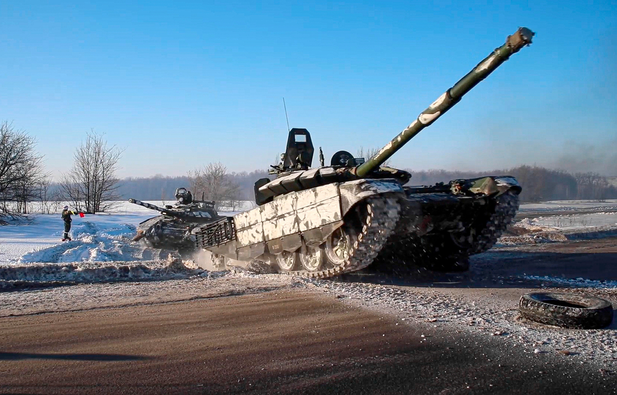 In this photo taken from video provided by the Russian Defense Ministry Press Service in Feburary, Russian tanks move back to their permanent base after drills. The price of gas in California climbed more than $1 per gallon within a month of Russian’s invasion of Ukraine.