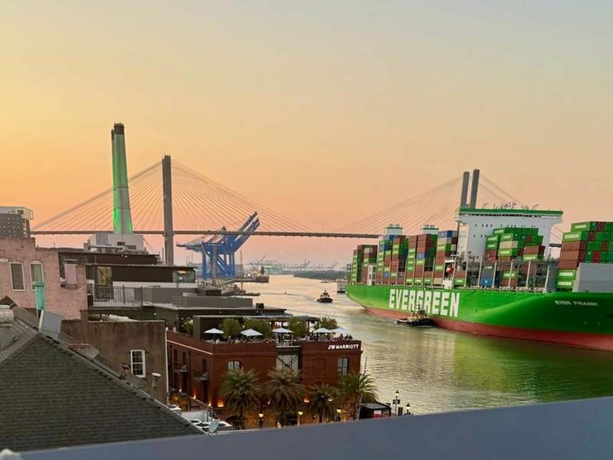  A cargo ship glides along the Savannah River, framed by the Talmadge Memorial Bridge in the background at evening twilight. Photo credit: Sharon Kurtz 