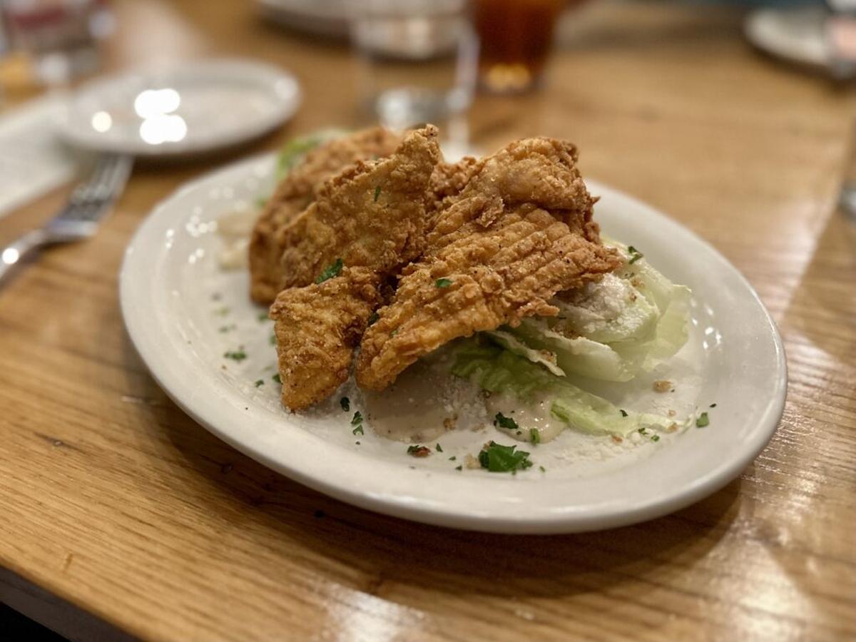  The ultimate kid camp food – chicken tenders – felt elevated when served atop a Caesar salad. Photo credit: Cathy Bennett Kopf 