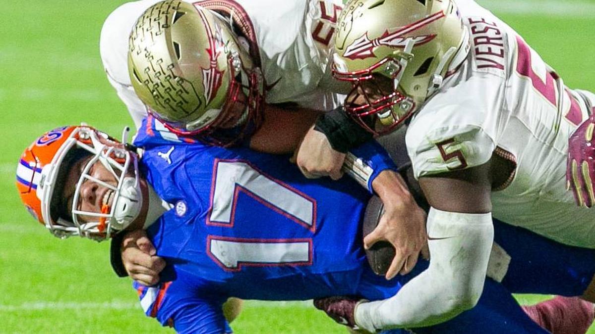  Florida Gators quarterback Max Brown (17) gets stopped by Florida State Seminoles defensive lineman Jared Verse (5) and Florida State Seminoles defensive lineman Braden Fiske (55) during first half action as Florida takes on Florida State at Steve Spurrier Field at Ben Hill Griffin Stadium in Gainesville, FL on Saturday, November 25, 2023. [Alan Youngblood/Gainesville Sun] | Alan Youngblood/Gainesville Sun / USA TODAY NETWORK 