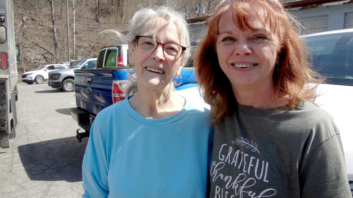 Gail Lendearo (left) and Christine Treleven are co-directors of the House of Hope food pantry in Delbarton, West Virginia. Lendearo says it's a blessing to serve those in need in her community. (Taylor Sisk/KFF Health News/TNS)