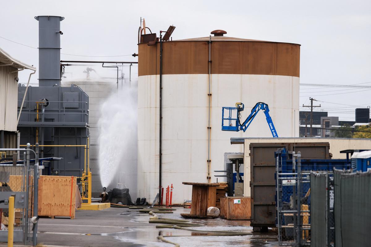 Water is sprayed during a chemical incident involving a leaking tank of methyl methacrylate, a flammable liquid used in the aerospace industry, forcing an evacuation in the surrounding area, in Garden Grove, California, U.S., May 23, 2026. REUTERS/David Swanson