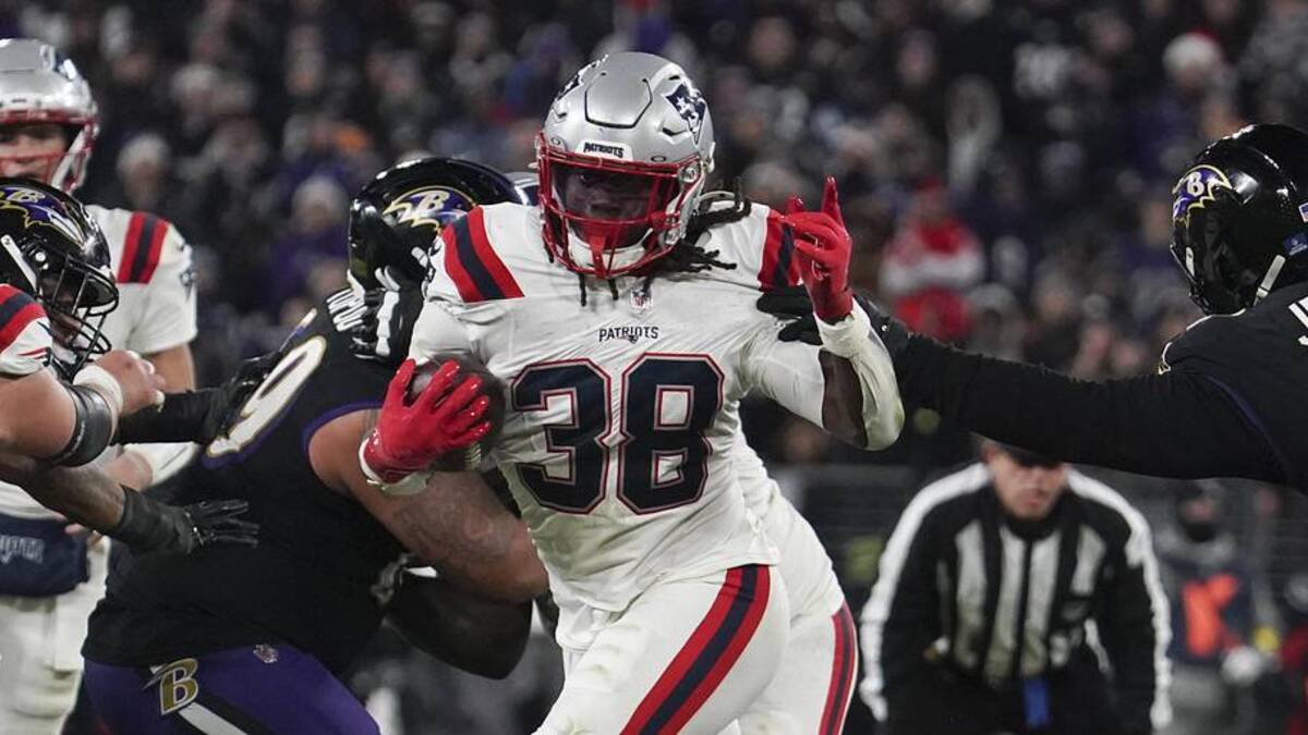 Dec 21, 2025; Baltimore, Maryland, USA; New England Patriots running back Rhamondre Stevenson (38) runs for a touchdown against Baltimore Ravens defensive tackle John Jenkins (94) during the second half of the game at M&T Bank Stadium. Mandatory Credit: James Lang-Imagn Images | James Lang-Imagn Images 