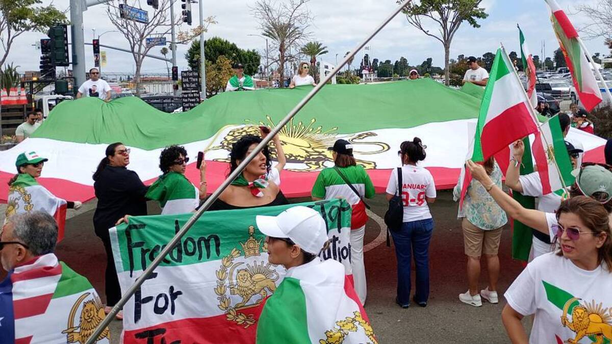  A giant Iran flag with the sun and lion insignia was unfurled. | Sports Illustrated 