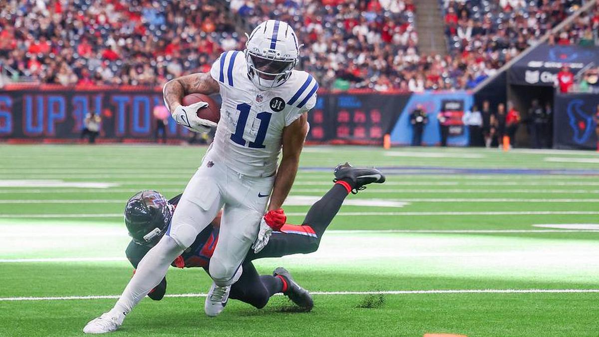  Jan 4, 2026; Houston, Texas, USA; Indianapolis Colts wide receiver Michael Pittman Jr. (11) breaks Houston Texans cornerback Alijah Huzzie (36) tackle and dives for the end zone in the second half half at NRG Stadium. Mandatory Credit: Thomas Shea-Imagn Images | Thomas Shea-Imagn Images 