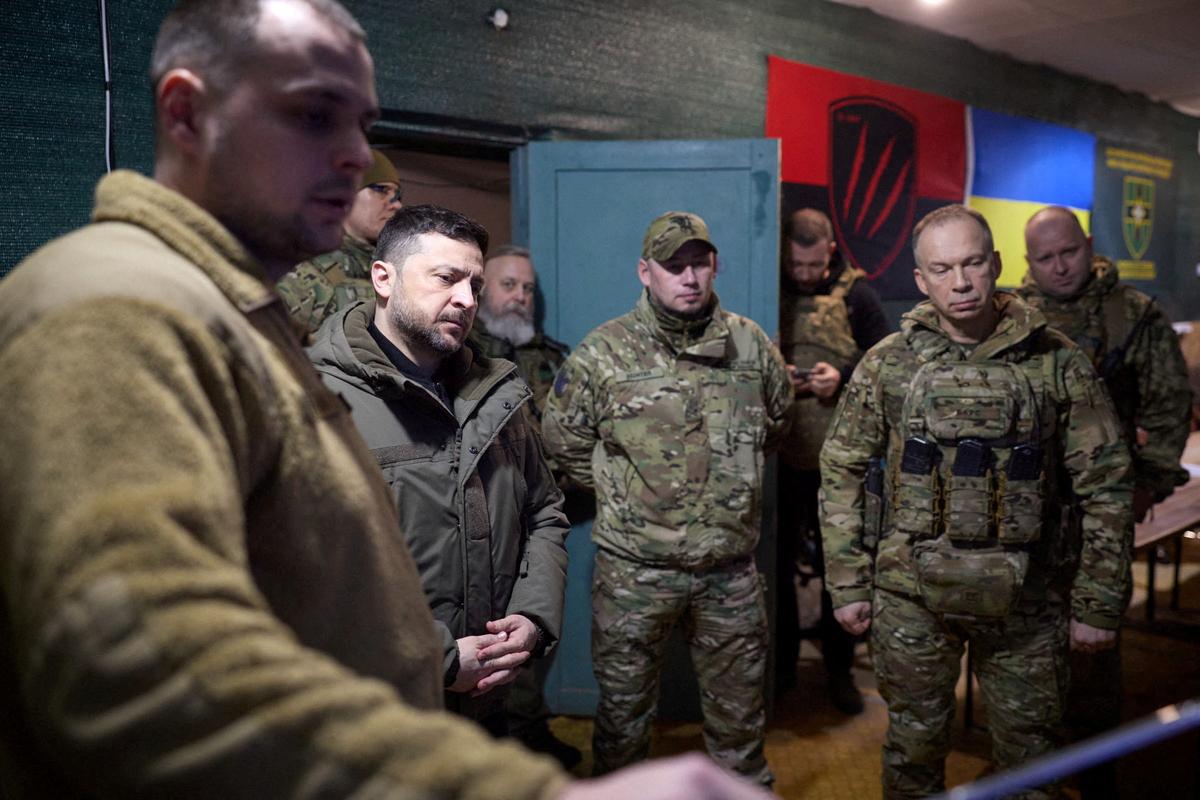 FILE PHOTO: Ukraine's President Volodymyr Zelenskiy, deputy head of his office Brigadier General Pavlo Palisa and Commander in Chief of the Ukrainian Armed Forces General Oleksandr Syrskyi visit a position of Ukrainian service members in the front line, amid Russia's attack on Ukraine, in Donetsk region, Ukraine March 6, 2026. Ukrainian Presidential Press Service/Handout via REUTERS /File Photo
