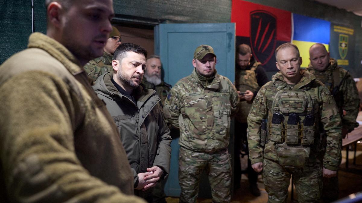 FILE PHOTO: Ukraine's President Volodymyr Zelenskiy, deputy head of his office Brigadier General Pavlo Palisa and Commander in Chief of the Ukrainian Armed Forces General Oleksandr Syrskyi visit a position of Ukrainian service members in the front line, amid Russia's attack on Ukraine, in Donetsk region, Ukraine March 6, 2026. Ukrainian Presidential Press Service/Handout via REUTERS /File Photo