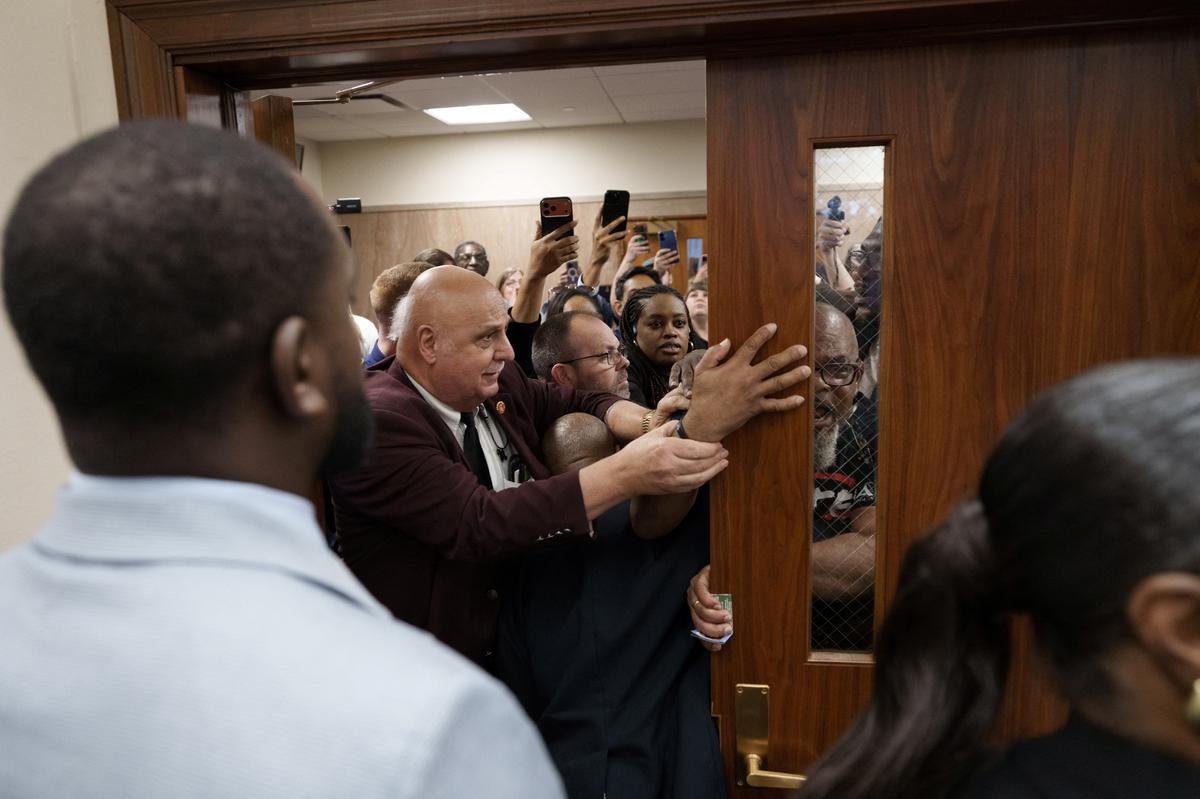Protesters try to enter the room during a public hearing on redistricting as Louisiana Republicans pursue a new congressional voting map ahead of the November midterm elections, in Baton Rouge, Louisiana, U.S., May 8, 2026. REUTERS/Wayan Barre