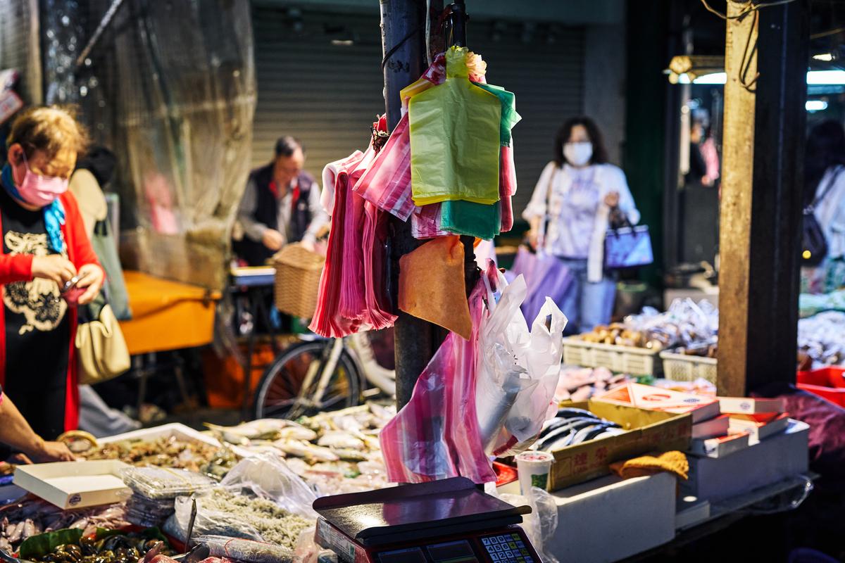 People shop the Xizhou Public Market, in Taipei, Taiwan on April 9, 2026. Plastic producers in Taiwan have scrambled to secure new supplies since the war in Iran disrupted petrochemical flows and tightened availability. (An Rong Xu/The New York Times)