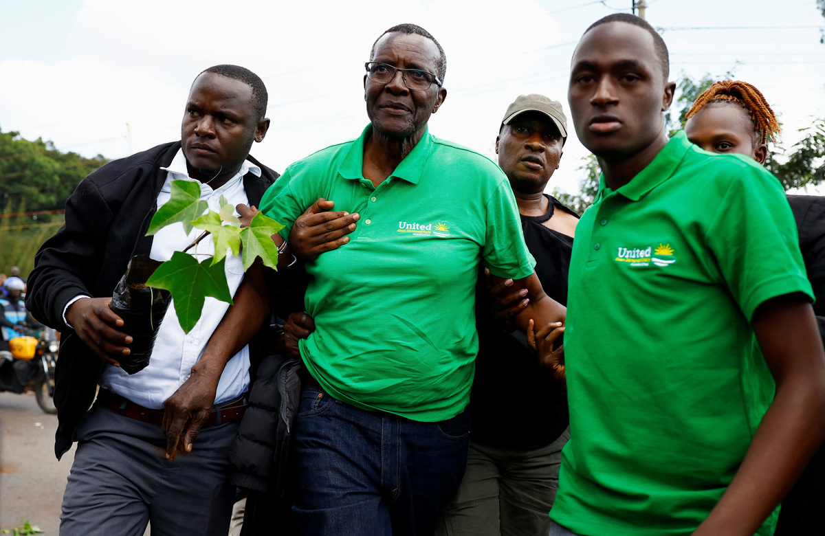 Former Chief Justice David Maraga is detained by plainclothes police officers alongside environmental activists for participating in a march against the encroachment of Nairobi National Park's land and plans to relocate the Nairobi Animal Orphanage in Nairobi, Kenya, June 8, 2026. REUTERS/Thomas Mukoya