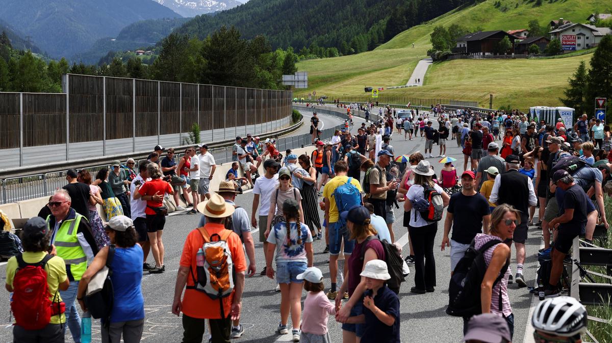 People walk on a closed motorway  as they protest against the growing traffic load on the Brenner motorway between Austria and Italy, near Matrei, Austria, May 30, 2026. REUTERS/Christian Mang