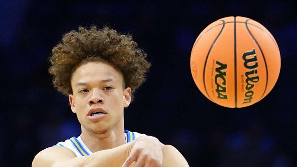  Mar 20, 2026; Philadelphia, PA, USA; UCLA Bruins guard Trent Perry (0) makes a pass against the UCF Knights in the first half during a first round game of the men's 2026 NCAA Tournament at Xfinity Mobile Arena. Mandatory Credit: Kyle Ross-Imagn Images | Kyle Ross-Imagn Images 