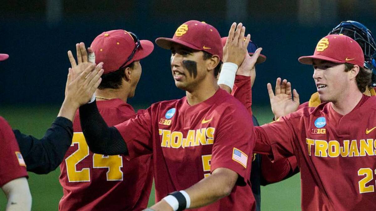  May 31, 2025; Corvallis, OR, USA; USC pitcher Caden Hunter (22) high-fives teammates after a game against Saint Mary's at the NCAA Corvallis Regional at Goss Stadium. Mandatory Credit: Troy Wayrynen-Imagn Images | IMAGN IMAGES via Reuters Connect 