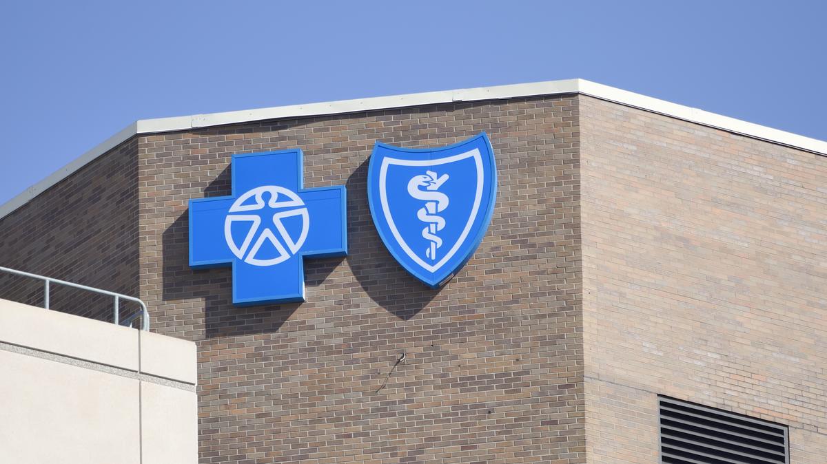 "Lansing, Michigan, USA - March 14, 2012: The Blue Cross Blue Shield location in Lansing, Michigan. Founded in 1929, the Blue Cross Blue Shield Association is a network of insurance organizations that insure almost 100 million Americans.". 