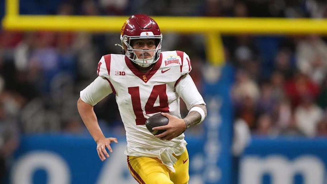  Dec 30, 2025; San Antonio, TX, USA; Southern California Trojans quarterback Jayden Maiava (14) carries the ball against the TCU Horned Frogs in the second half during the Alamo Bowl at Alamodome. Mandatory Credit: Kirby Lee-Imagn Images | Kirby Lee-Imagn Images 
