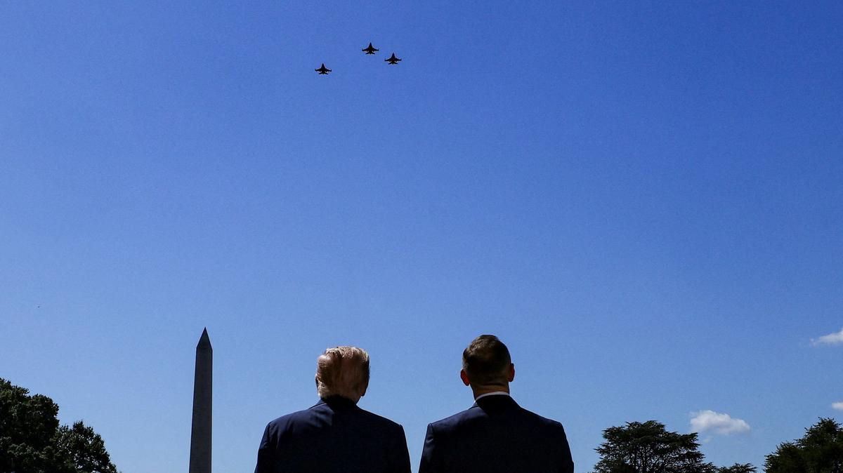 U.S. President Donald Trump and the President of Poland Karol Nawrocki watch a flyover of military planes at the White House in Washington, D.C., U.S., September 3, 2025.  REUTERS/Brian Snyder