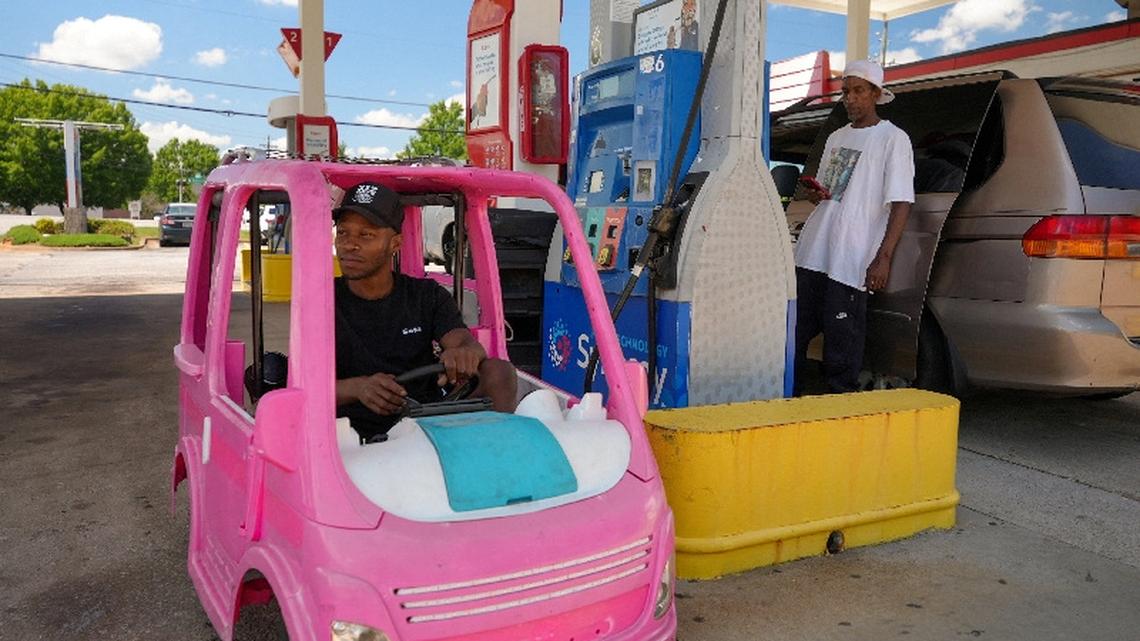 High gas prices spur Americans to improvise, from bus rides to toy cars 