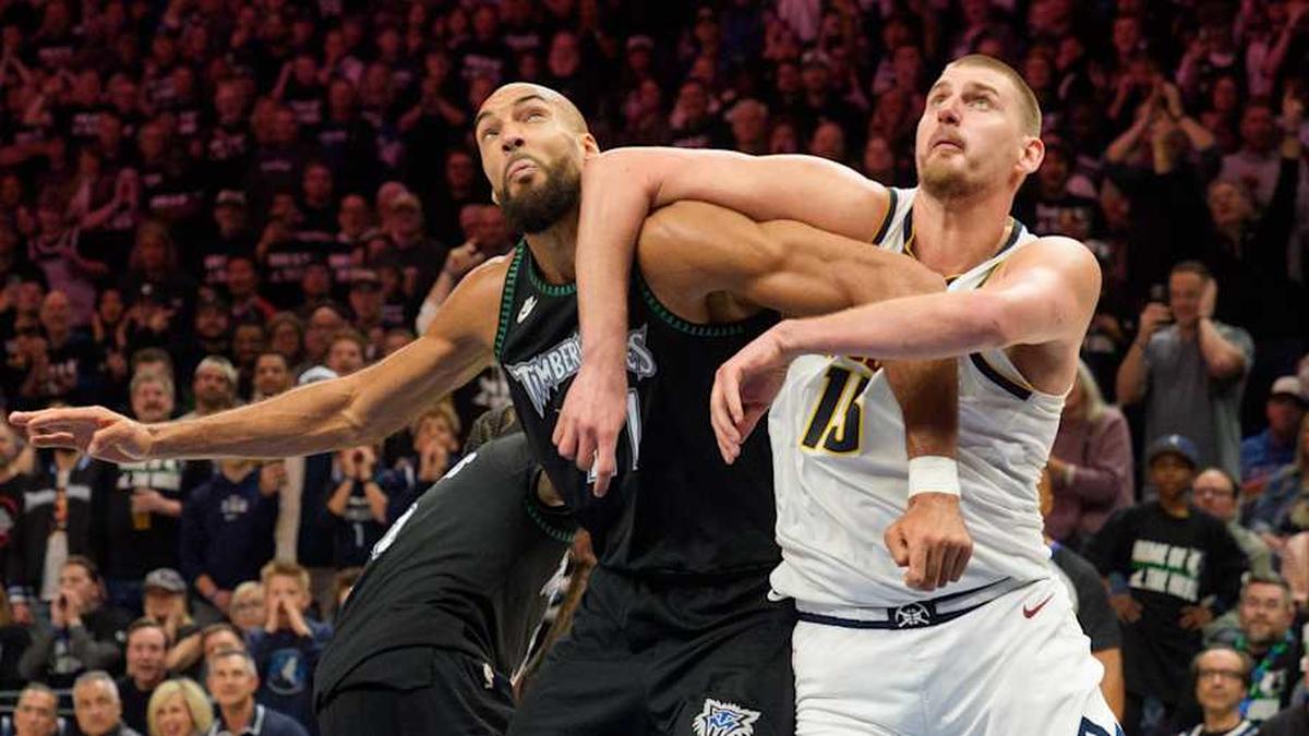  Timberwolves center Rudy Gobert and Nuggets center Nikola Jokić battle for position. | Matt Blewett-Imagn Images 