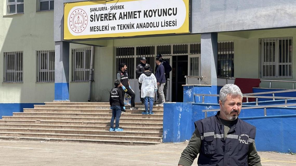 Turkish police investigators work at the site of a shooting that took place in a school in the Siverek district of Sanliurfa on Tuesday. At least 16 people were injured after a former student opened fire at the Ahmet Koyuncu Vocational and Technical Anatolian High School, then fatally shot himself.
