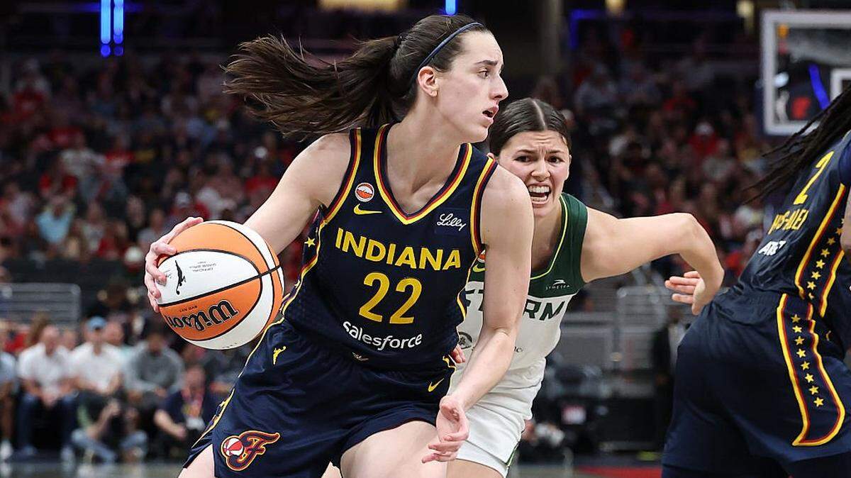 Caitlin Clark (22) of the Indiana Fever dribbles the ball against the Seattle Storm on May 17 in Indianapolis, Indiana.