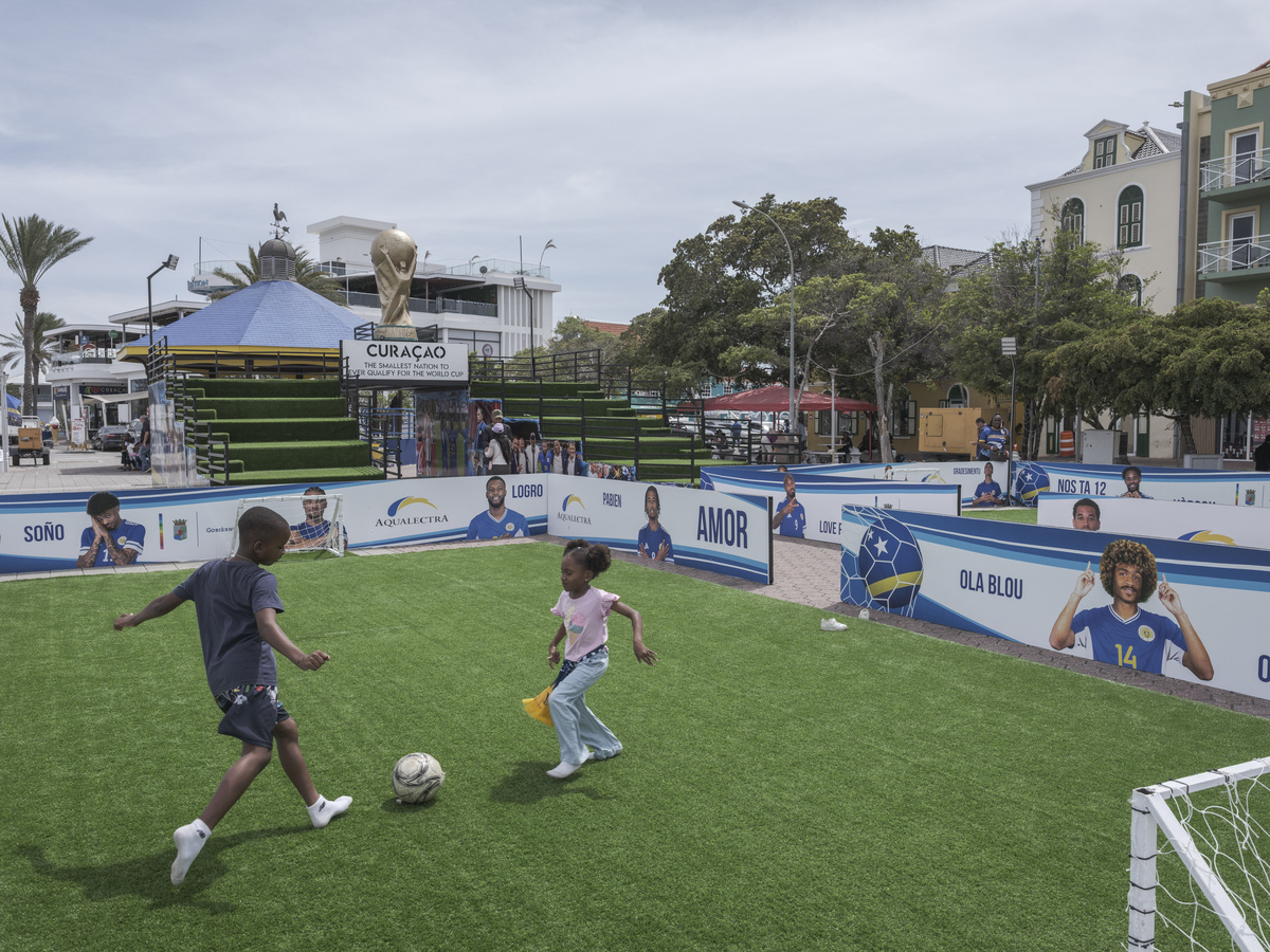 Children play at a soccer field that commemorates Curacao's qualification for the World Cup, in Willemstad, Curacao, June 5, 2026. Competing for the first time in the World Cup soccer tournament, Curacao is brimming with joy. (Luis Antonio Rojas/The New York Times)