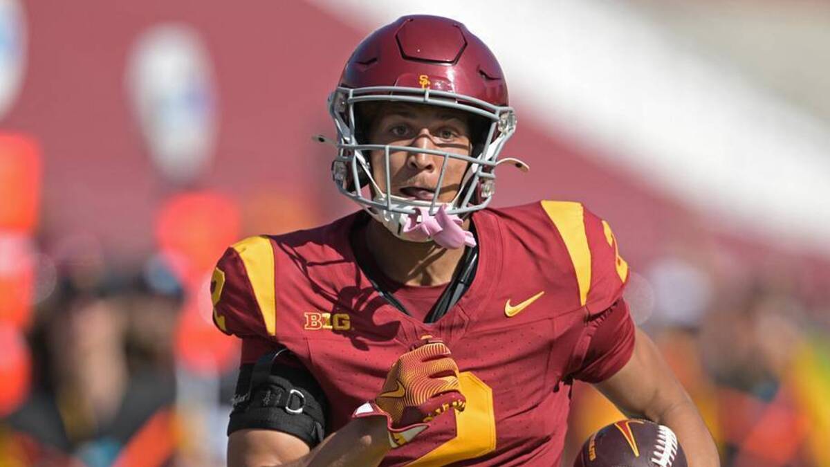  Oct 12, 2024; Los Angeles, California, USA; USC Trojans wide receiver Duce Robinson (2) runs the ball after a complete pass before he is stopped by Penn State Nittany Lions safety Zakee Wheatley (6) in the second half at United Airlines Field at the Los Angeles Memorial Coliseum. | Jayne Kamin-Oncea-Imagn Images 