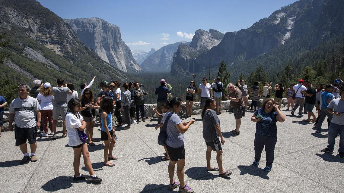 Visitors take in Yosemite National Park. The push to cut the National Park System even further - ahead not only of peak season but of America’s 250th birthday, which the Trump administration has promoted in relation to national parks - has underscored ongoing questions about how smoothly parks can operate as warm weather and summer vacations draw tourists.