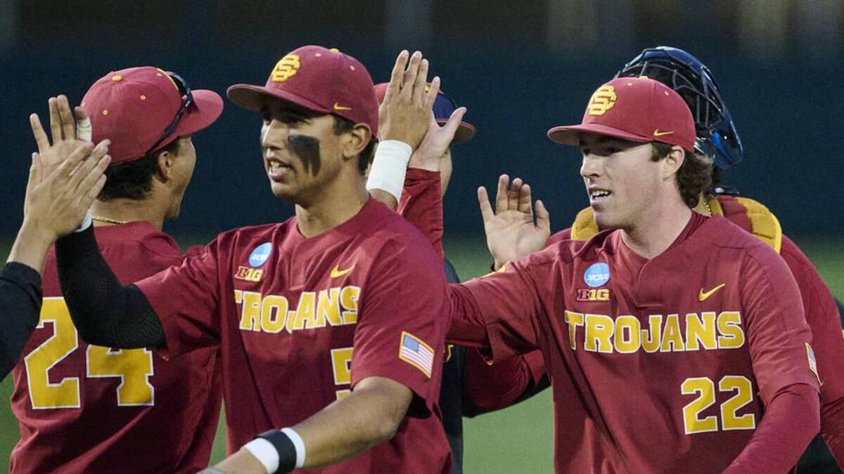  May 31, 2025; Corvallis, OR, USA; USC pitcher Caden Hunter (22) high-fives teammates after a game against Saint Mary's at the NCAA Corvallis Regional at Goss Stadium. Mandatory Credit: Troy Wayrynen-Imagn Images | Troy Wayrynen-Imagn Images 