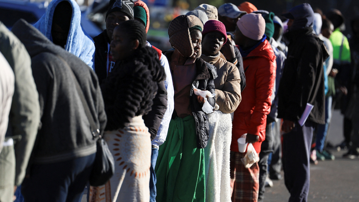 Zimbabwean migrants queue outside the Cape Town Home Affairs office on the day of an unofficial deadline set by anti-immigrant groups for all undocumented migrants to leave, in Cape Town, South Africa, June 30, 2026. REUTERS/Esa Alexander