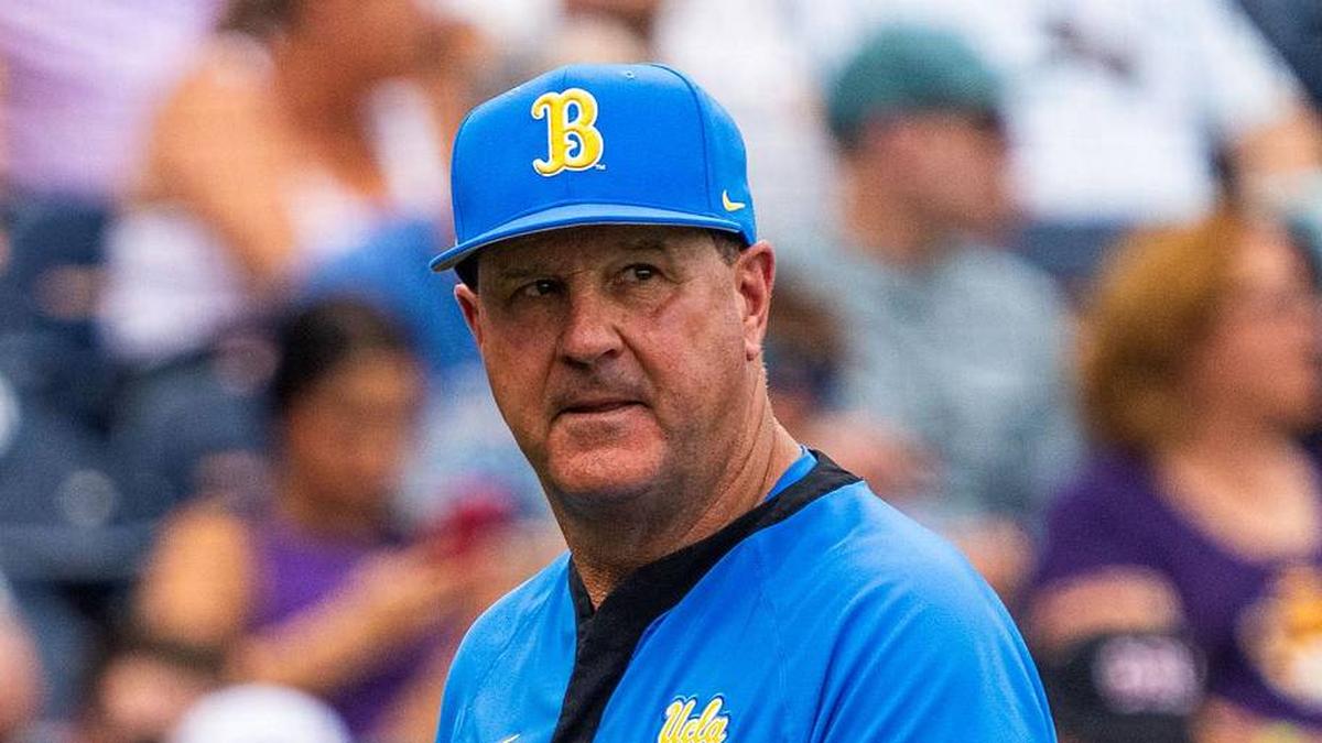  Jun 16, 2025; Omaha, Neb, USA; UCLA Bruins head coach John Savage walks off the field before the game against the LSU Tigers at Charles Schwab Field. Mandatory Credit: Dylan Widger-Imagn Images | Dylan Widger-Imagn Images 