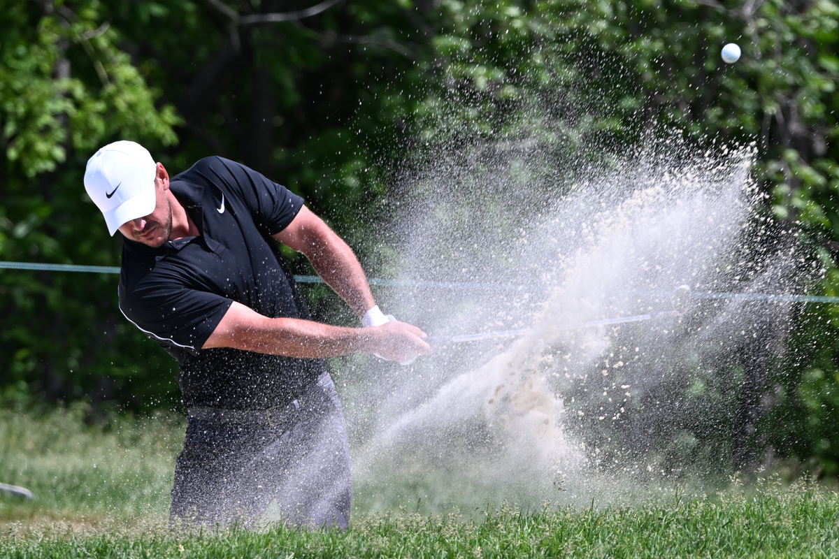 Jun 12, 2026; Caledon, Ontario, CAN;   Brooks Koepka plays a bunker shot on the eighth hole during the second round of the RBC Canadian Open golf tournament. Mandatory Credit: Dan Hamilton-Imagn Images