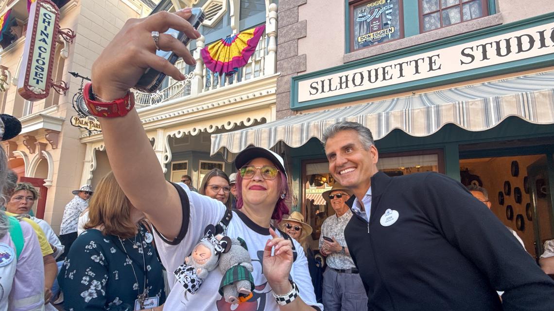Raeanne Agueros takes a selfie with Josh D’Amaro, then the chairman of Walt Disney Parks and Resorts, on Main Street, U.S.A. during the 70th anniversary Disneyland on July 17, 2025, ￼in Anaheim, CA. ￼ (Photo by Jeff Gritchen, Orange County Register/SCNG)
