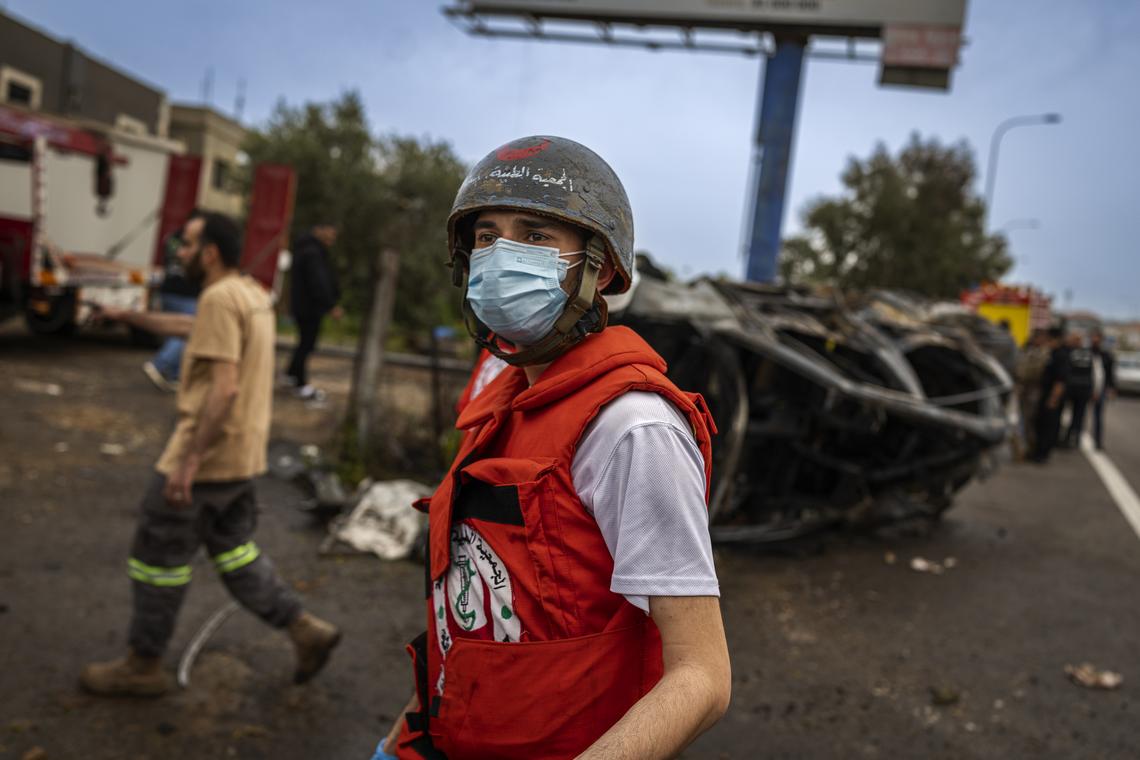 A Lebanese paramedic at the site of Israeli strikes on two vehicles along the Beirut-Saida highway, in Beirut, April 15, 2026. (Diego Ibarra Sánchez/The New York Times)