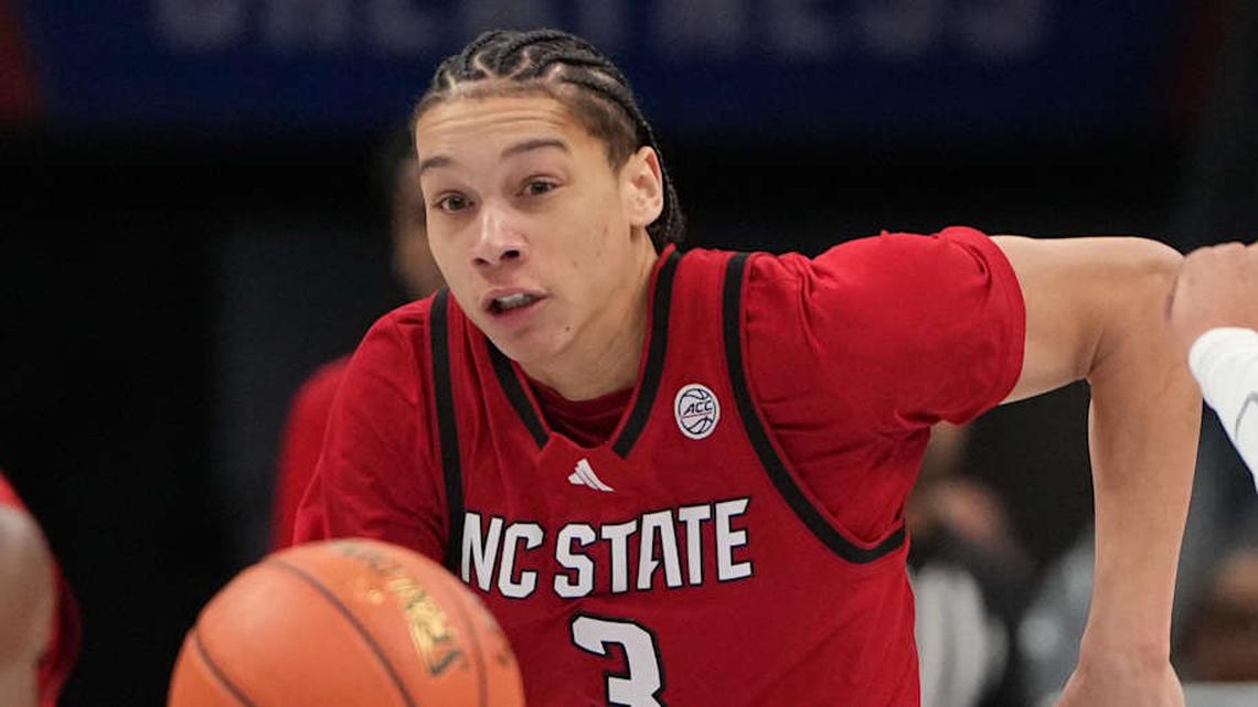  Mar 12, 2026; Charlotte, NC, USA; NC State Wolfpack guard Matt Able (3) and Virginia Cavaliers forward Devin Tillis (11) fight for the ball in the first half at Spectrum Center. Mandatory Credit: Bob Donnan-Imagn Images | Bob Donnan-Imagn Images 
