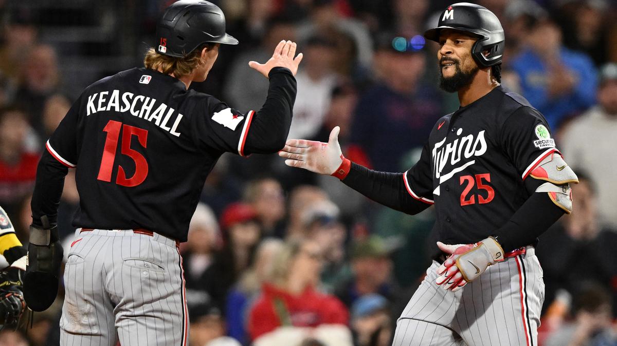 The Minnesota Twins' Byron Buxton (25) celebrates with Luke Keaschall (15) after hitting a two-run home run against the Boston Red Sox during the seventh inning at Fenway Park on Friday, May 22, 2026, in Boston. (Brian Fluharty/Getty Images/TNS)