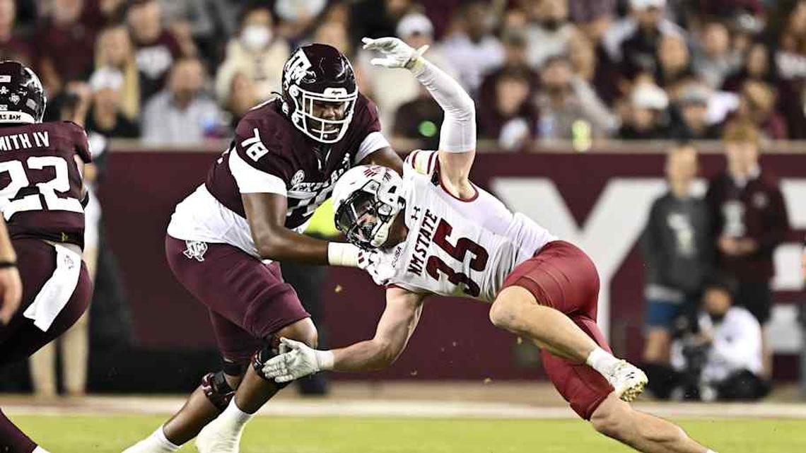  Nov 16, 2024; College Station, Texas, USA; New Mexico State Aggies linebacker Tyler Martinez (35) defends in coverage as Texas A&M Aggies offensive lineman Dametrious Crownover (78) blocks during the second half at Kyle Field. Mandatory Credit: Maria Lysaker-Imagn Images | Maria Lysaker-Imagn Images 