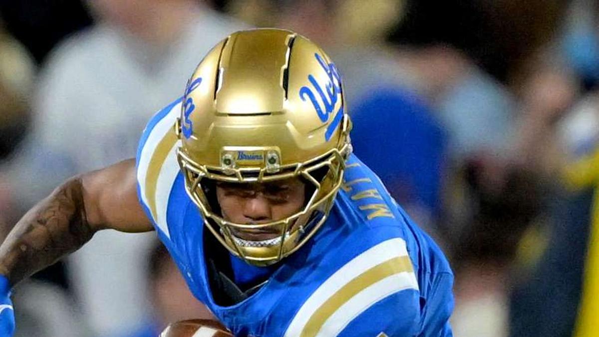  Nov 22, 2025; Pasadena, California, USA; Washington Huskies safety Rahshawn Clark (2) forces a fumble by UCLA Bruins wide receiver Mikey Matthews (7) during the first half the Rose Bowl. Mandatory Credit: Jayne Kamin-Oncea-Imagn Images | Jayne Kamin-Oncea-Imagn Images 