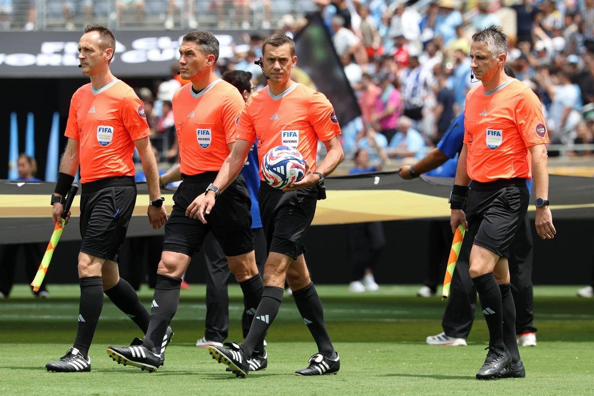  FIFA referee Clement Turpin and the other officials walk onto the field before a group stage match of the 2025 FIFA Club World Cup IMAGN IMAGES via Reuters Connect