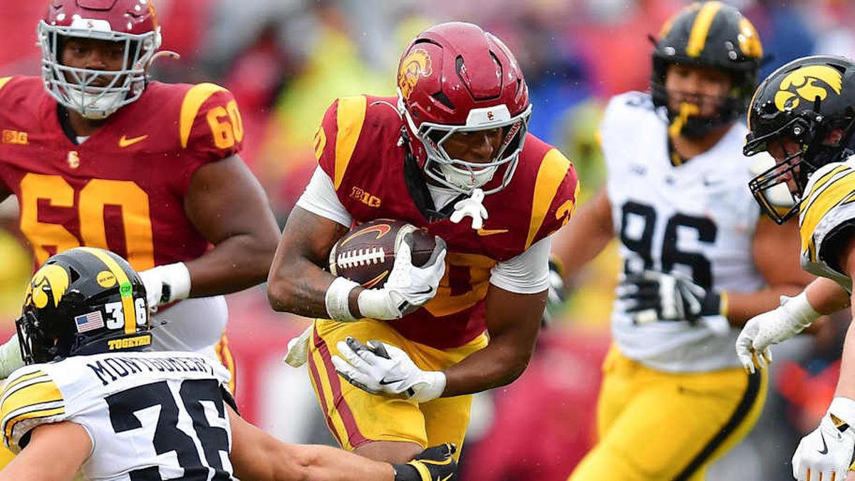  Nov 15, 2025; Los Angeles, California, USA; Southern California Trojans running back King Miller (30) runs the ball against Iowa Hawkeyes linebacker Jayden Montgomery (36) during the first half at the Los Angeles Memorial Coliseum. Mandatory Credit: Gary A. Vasquez-Imagn Images | Gary A. Vasquez-Imagn Images 