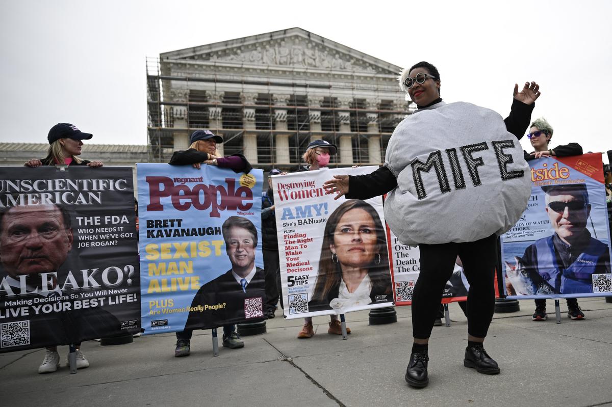  A woman dressed as a mifepristone pill dances with pro-choice activists during a protest outside the U.S. Supreme Court on April 2, 2025. 