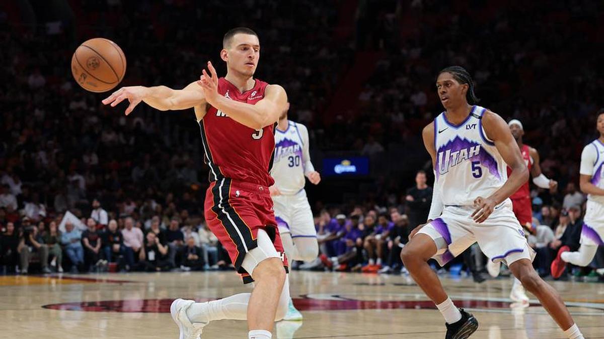  Feb 9, 2026; Miami, Florida, USA; Miami Heat forward Nikola Jovic (5) passes the basketball as Utah Jazz forward Cody Williams (5) defends during the third quarter at Kaseya Center. Mandatory Credit: Sam Navarro-Imagn Images | Sam Navarro-Imagn Images 