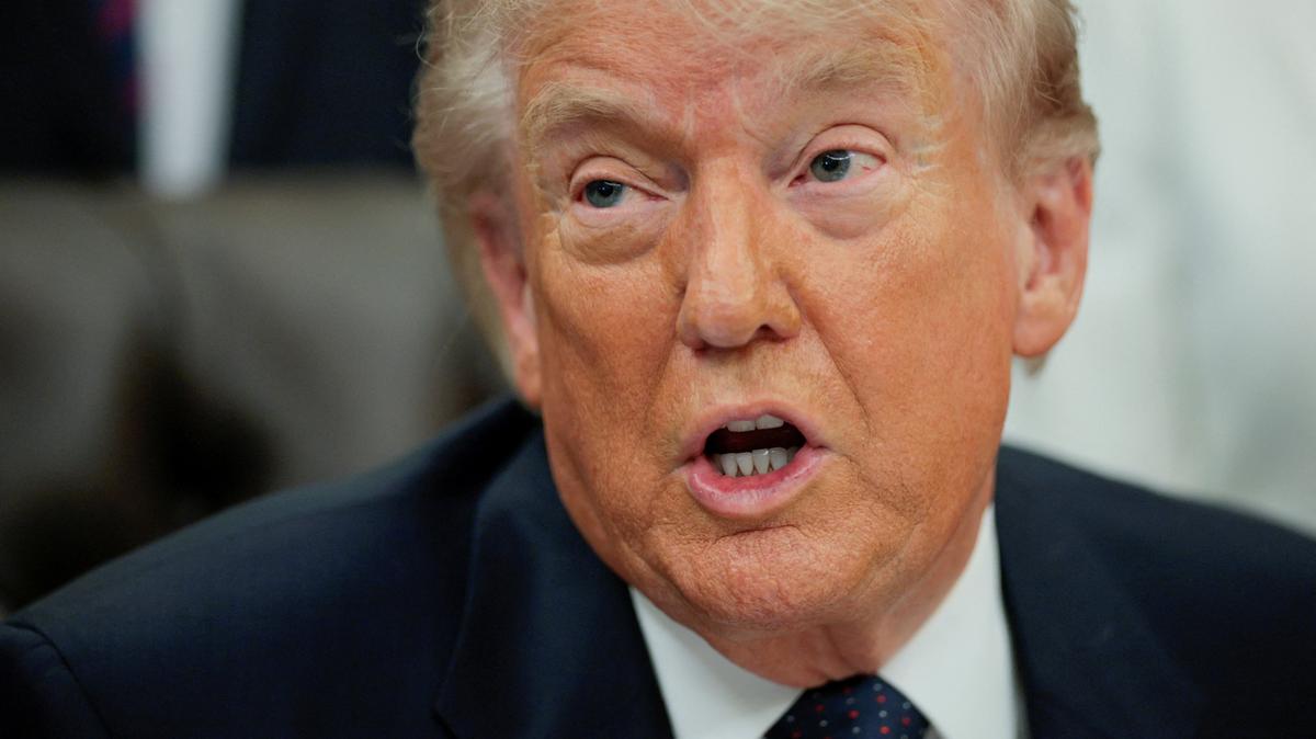 FILE PHOTO: U.S. President Donald Trump speaks during an event to sign a memorandum in the Oval Office at the White House in Washington, D.C., U.S., May 5, 2026. REUTERS/Evan Vucci/File Photo