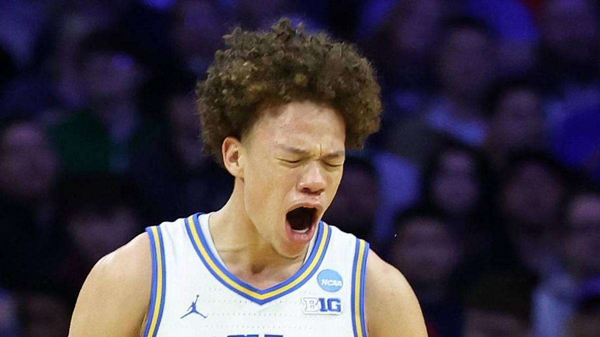  Mar 20, 2026; Philadelphia, PA, USA; UCLA Bruins guard Trent Perry (0) reacts with guard Eric Freeny (8) in the second half during a first round game of the men's 2026 NCAA Tournament at Xfinity Mobile Arena. Mandatory Credit: Bill Streicher-Imagn Images | Bill Streicher-Imagn Images 