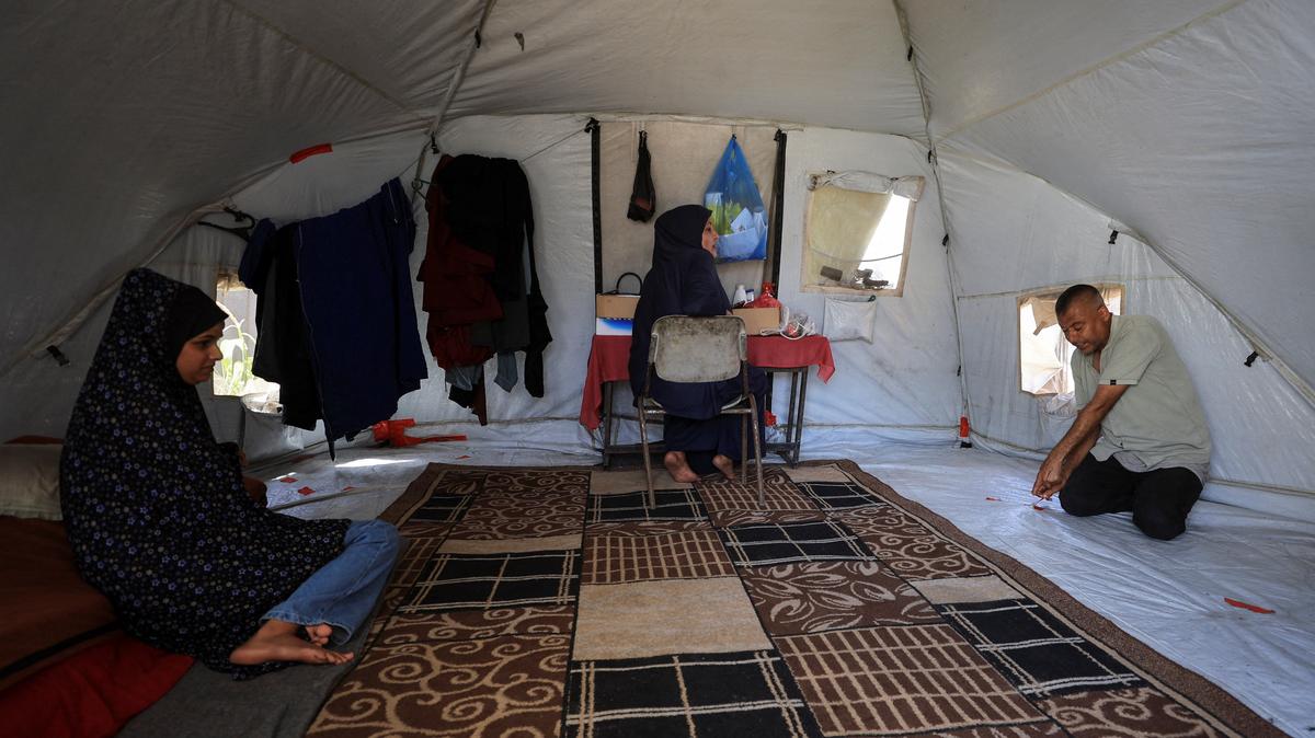 Displaced Palestinians sit at a tent camp sheltering displaced people in Gaza City, May 11, 2026. REUTERS/Dawoud Abu Alkas
