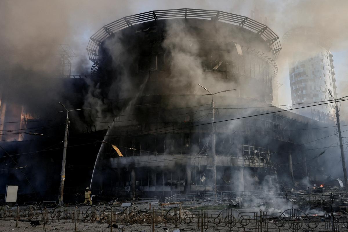 A firefighter works at the site of a damaged building in the aftermath of an overnight Russian missile and drone strike, amid Russia's attack on Ukraine, in Kyiv, Ukraine, May 24, 2026. REUTERS/Thomas Peter