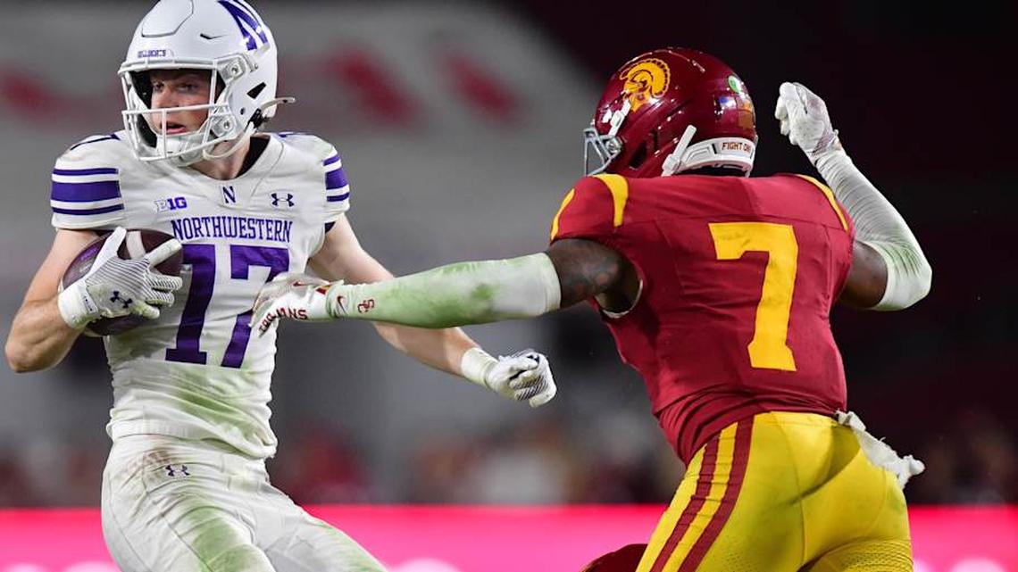  Nov 7, 2025; Los Angeles, California, USA; Northwestern Wildcats wide receiver Griffin Wilde (17) runs the ball against Southern California Trojans safety Kamari Ramsey (7) during the second half at the Los Angeles Memorial Coliseum. Mandatory Credit: Gary A. Vasquez-Imagn Images | Gary A. Vasquez-Imagn Images 