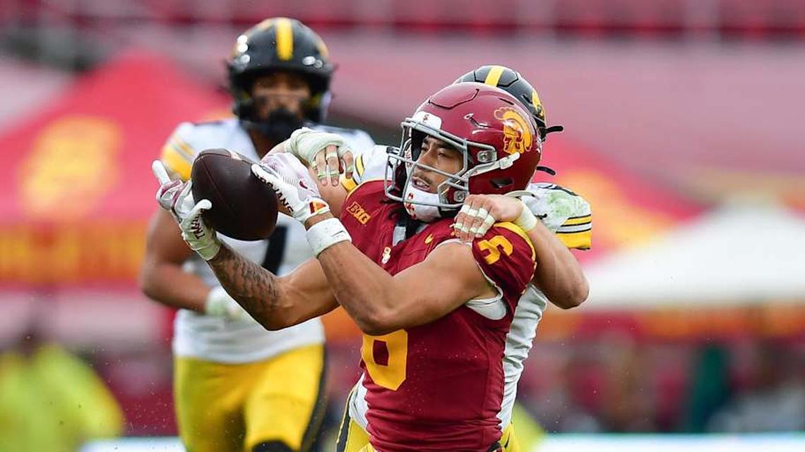  Nov 15, 2025; Los Angeles, California, USA; Southern California Trojans wide receiver Makai Lemon (6) catches a pass against the defense of Iowa Hawkeyes defensive back Zach Lutmer (6) during the second half at the Los Angeles Memorial Coliseum. Mandatory Credit: Gary A. Vasquez-Imagn Images | Gary A. Vasquez-Imagn Images 