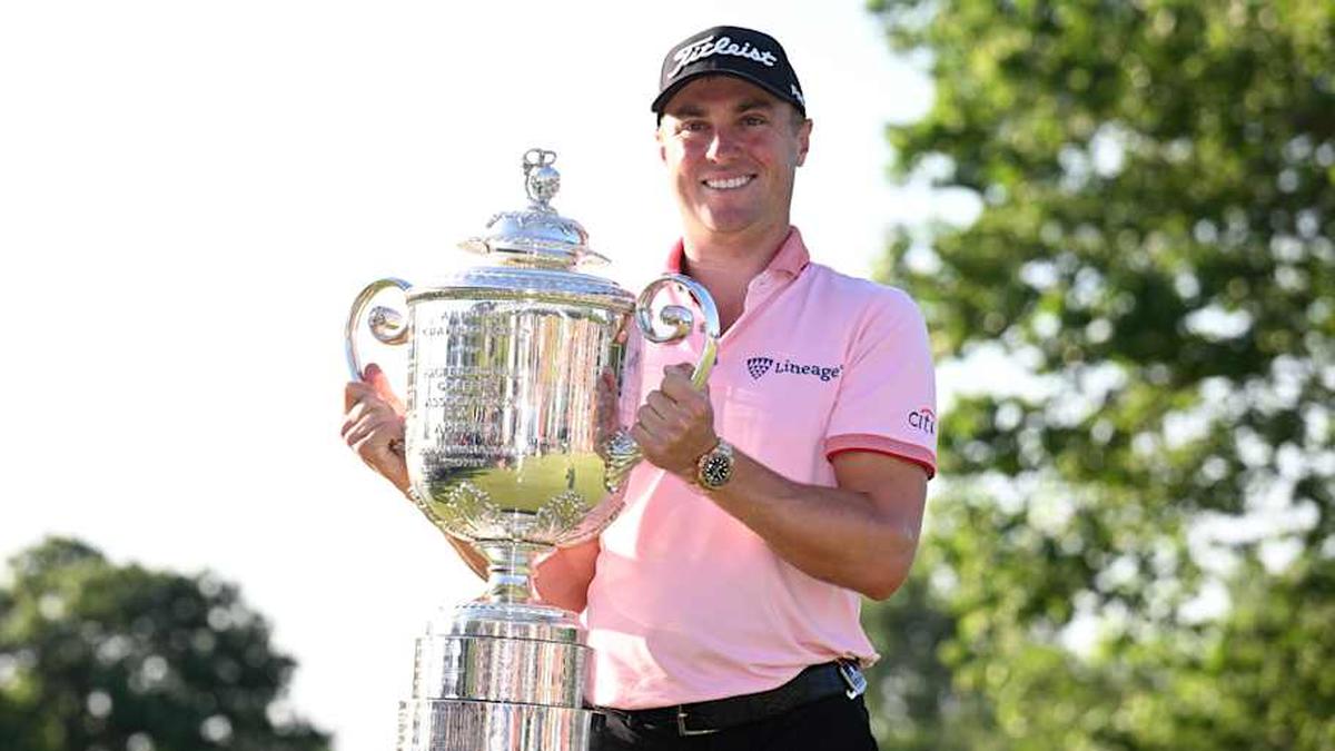  Justin Thomas poses with the Wanamaker trophy after winning the PGA Championship at Southern Hills Country Club. | Orlando Ramirez-Imagn Images 