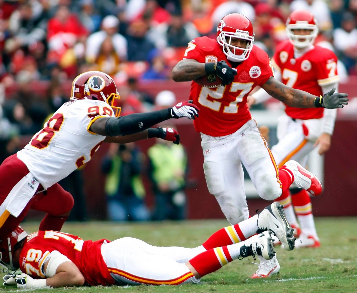  Kansas City Chiefs running back Larry Johnson carries as Washington Redskins defensive end Brian Orakpo tries to make the tackle. Geoff Burke-USA TODAY Sports